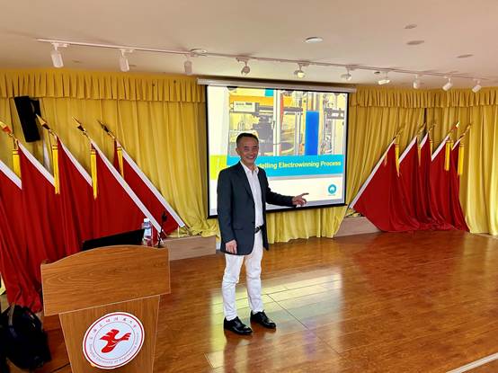 A person standing in front of a podium
Description automatically generated